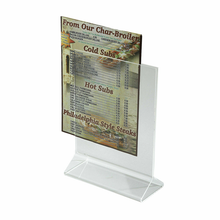 acrylic table top sign holder with paper menu being slid into it.