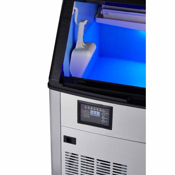 Close up of Berg undercounter ice machine showing ice scoop and digital controls