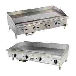 Two stainless steel griddles.