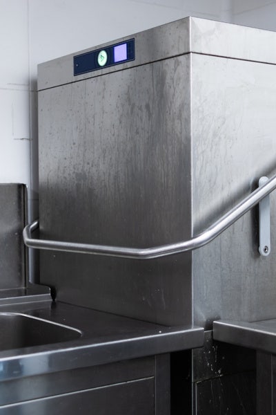 Stainless steel commercial dishwasher.