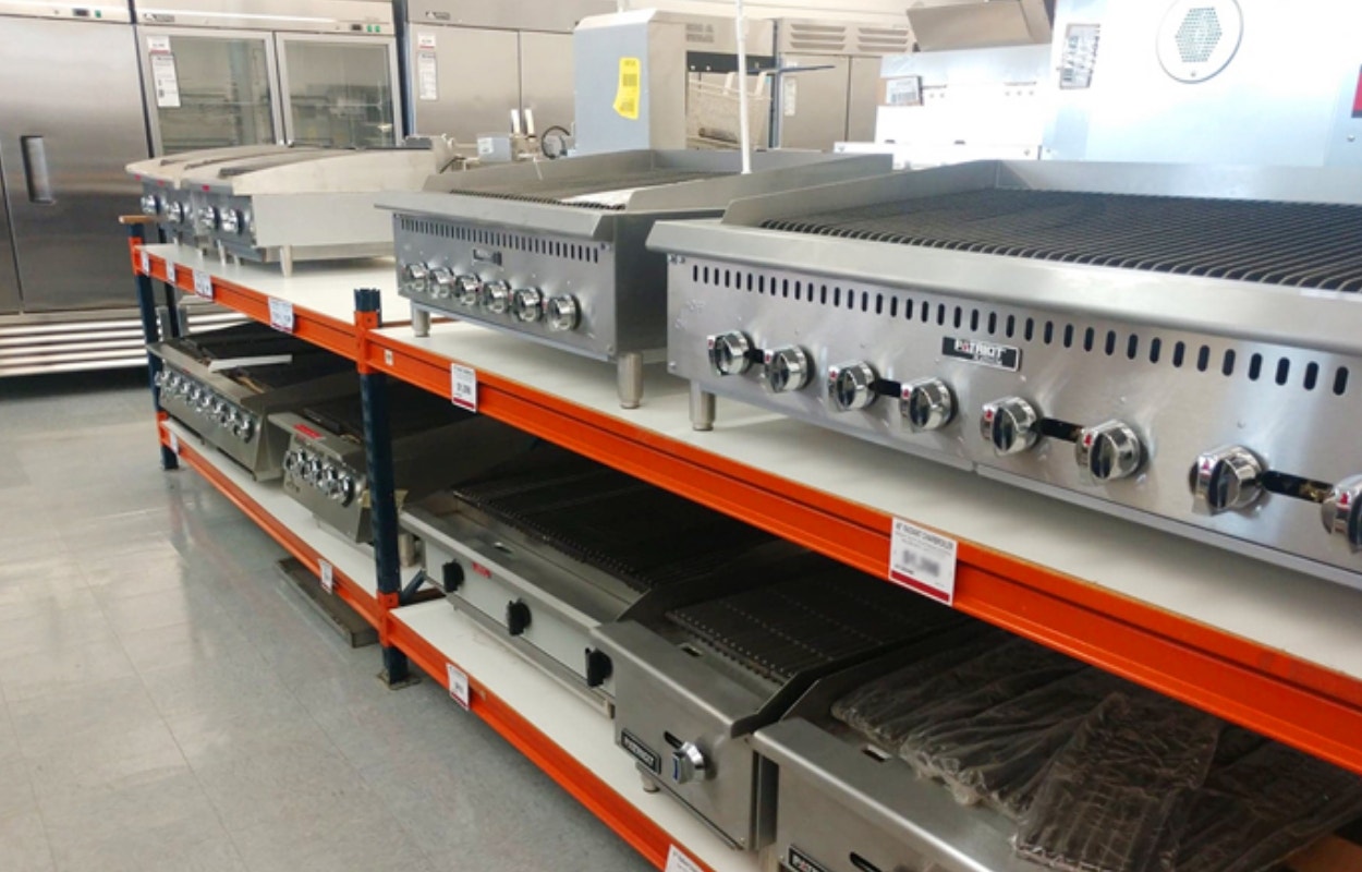 Commercial countertop charbroilers displayed on a shelf. Electric, natural gas and liquid propane.