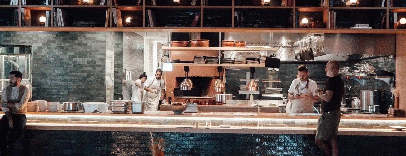 customer making order at table in modern restaurant