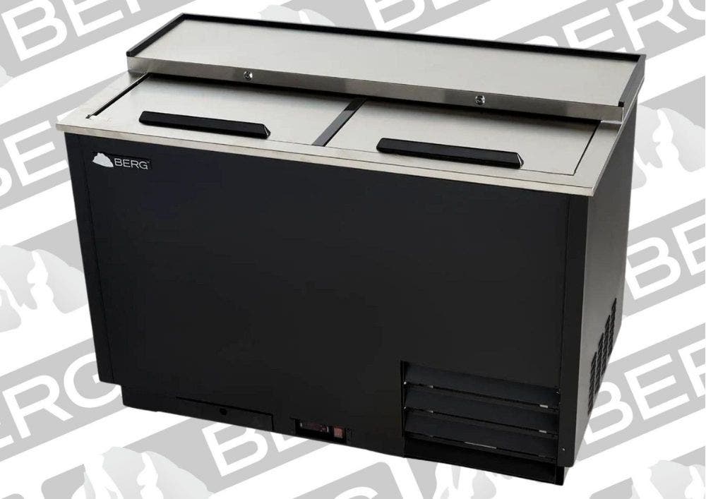 A black sided Berg refrigerated Glass and Plate Froster with a silver-colored stainless steel top with sliding doors on top.