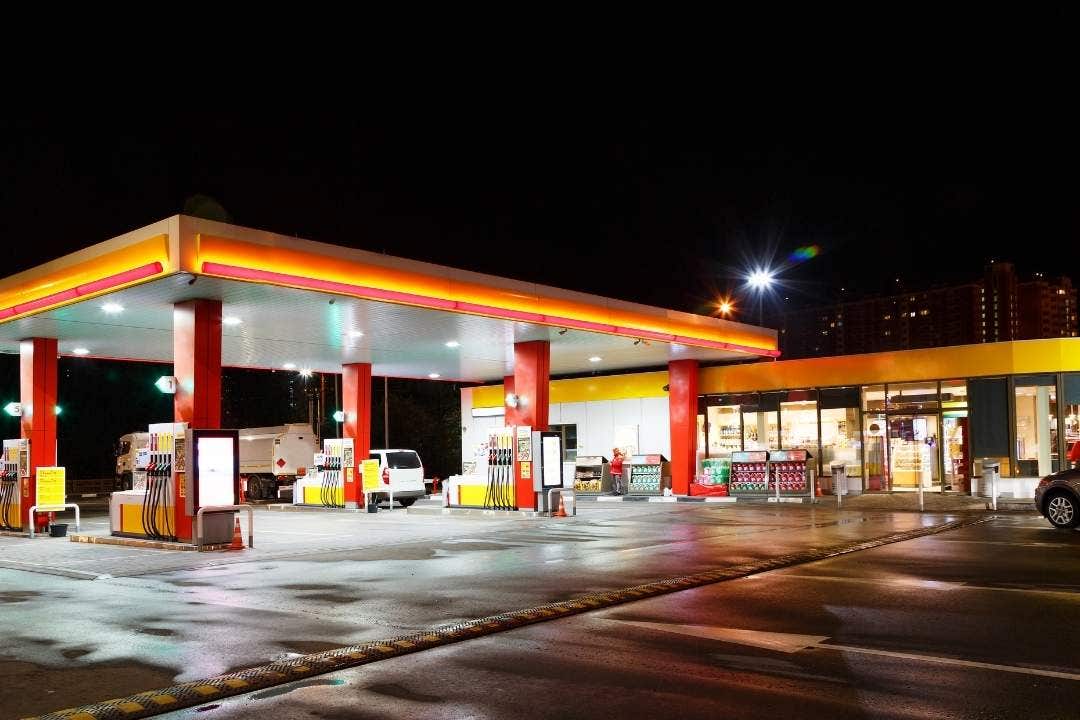 Well-lit convenience store and gas station at night