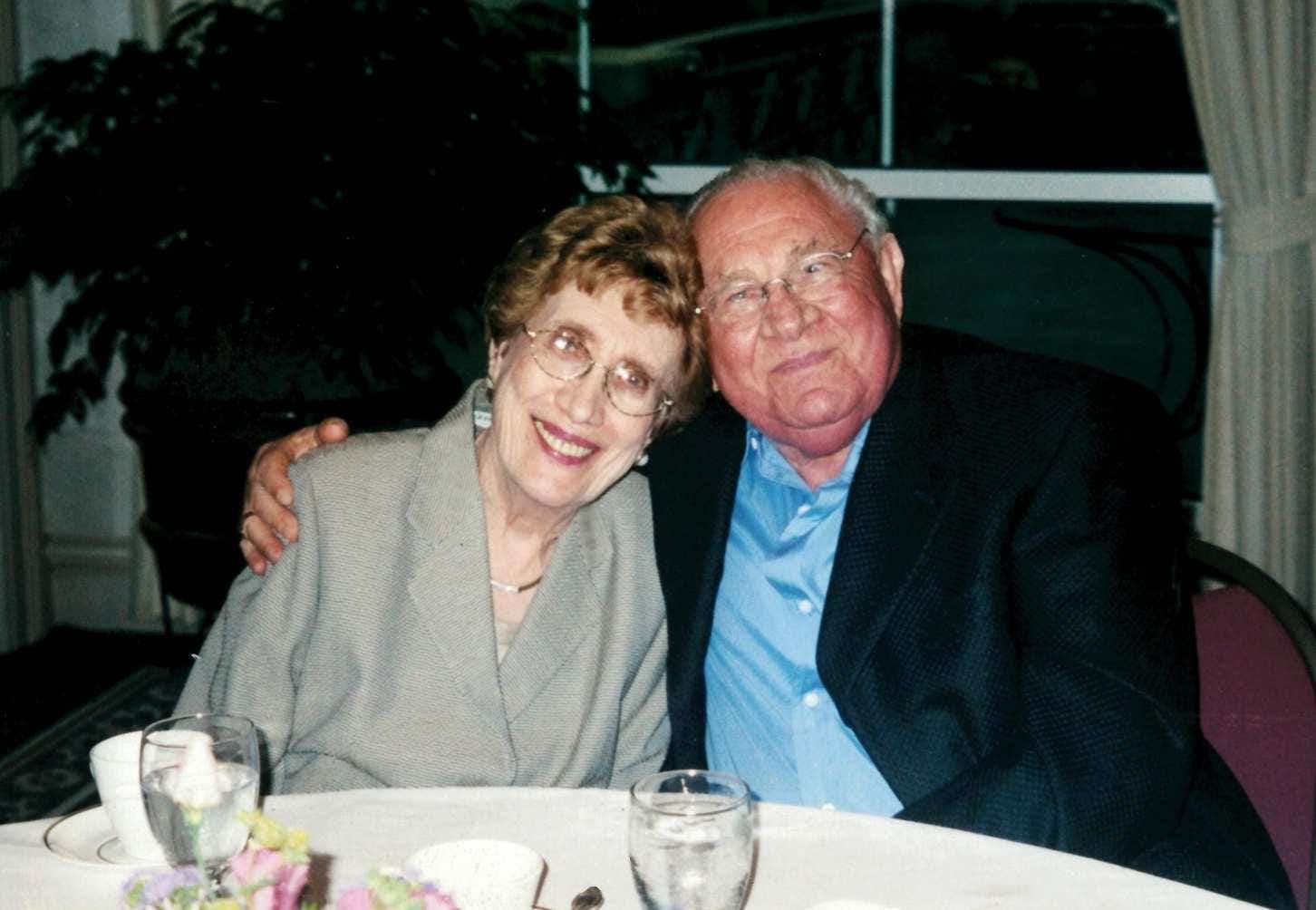 morris dach and wife sitting at a dining table